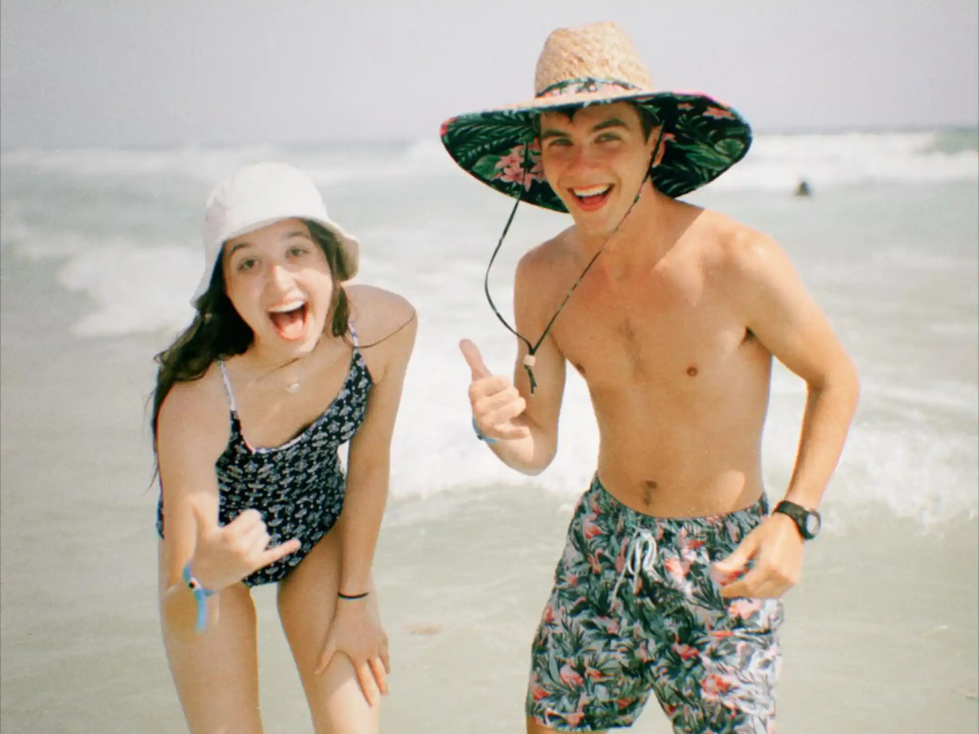 a man and woman on a beach