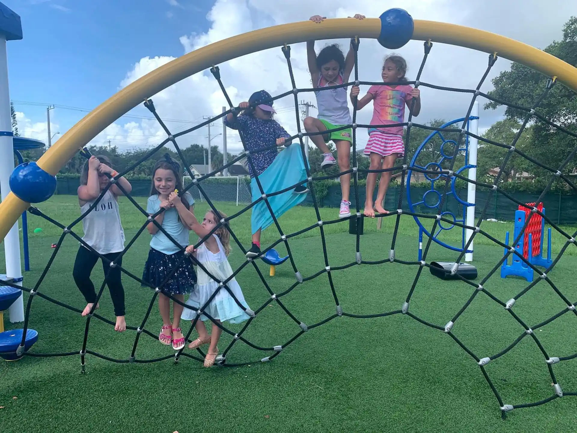a group of people on a swing set