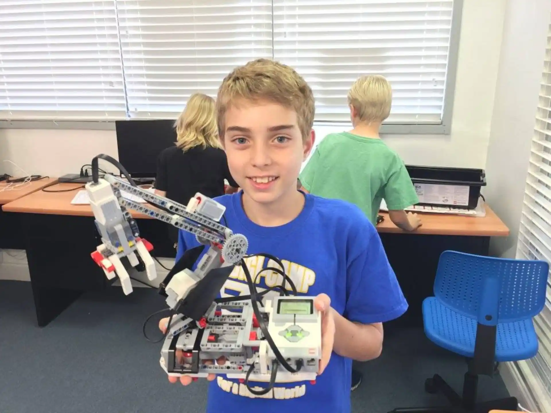 a boy holding a toy