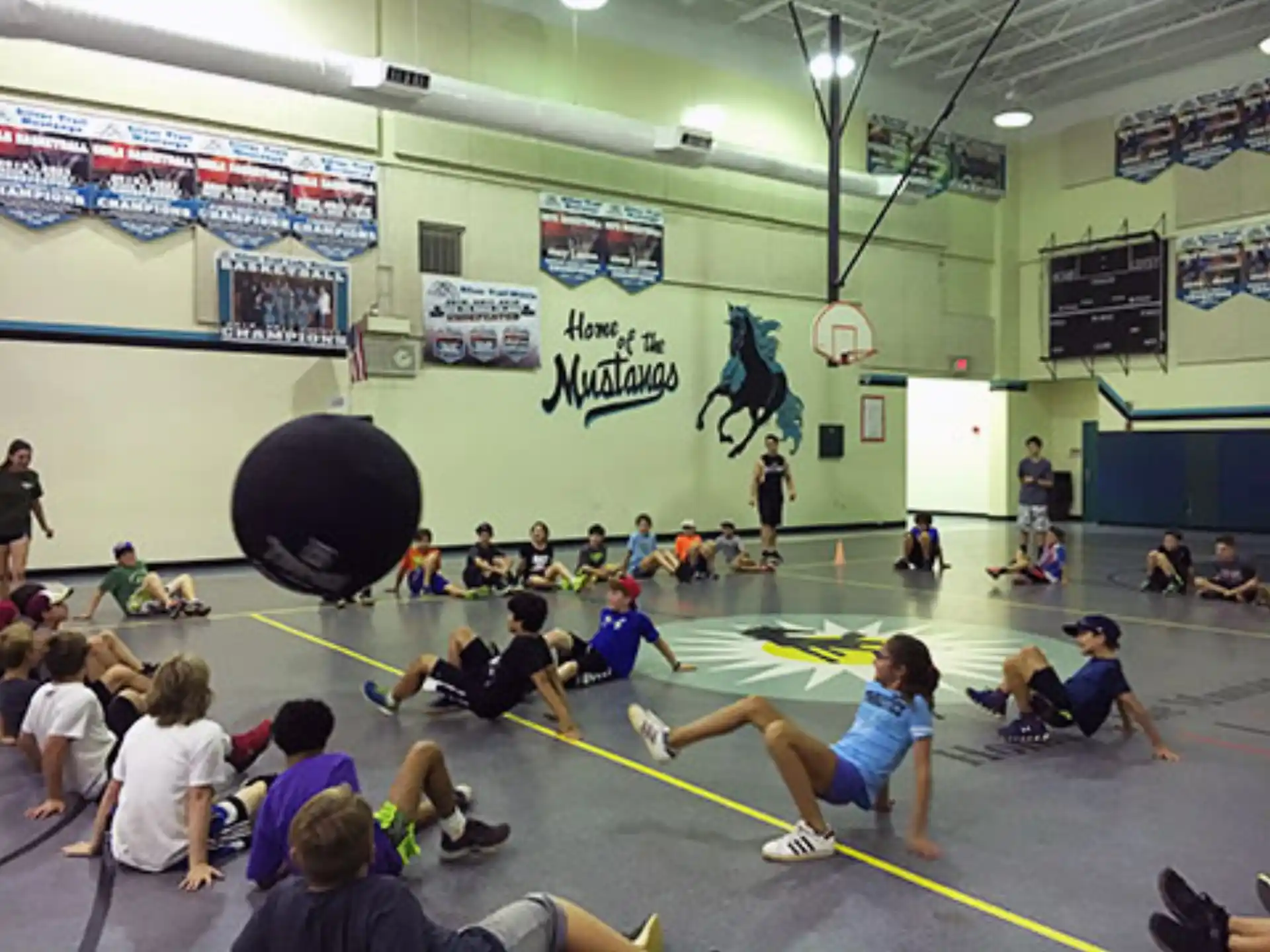a group of people in a gym