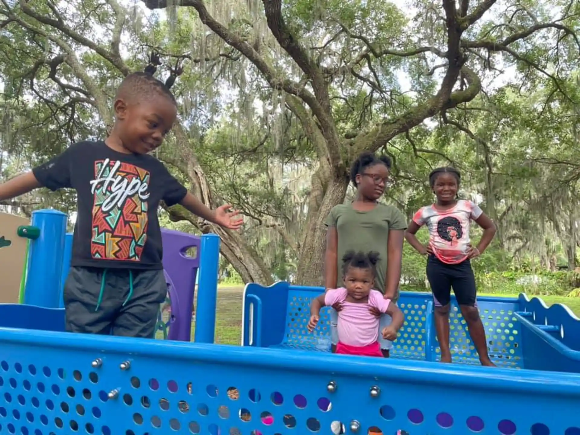 a group of children playing in a water park