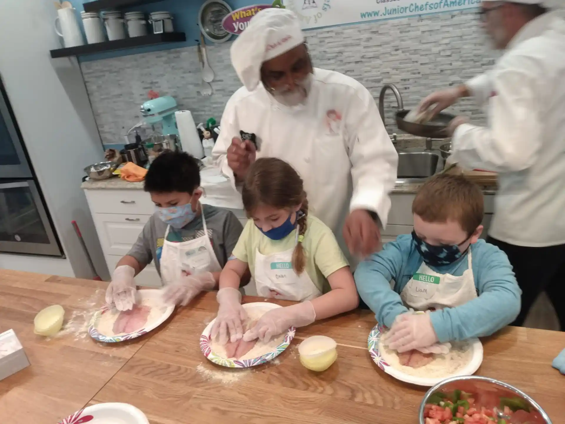 a group of kids making food