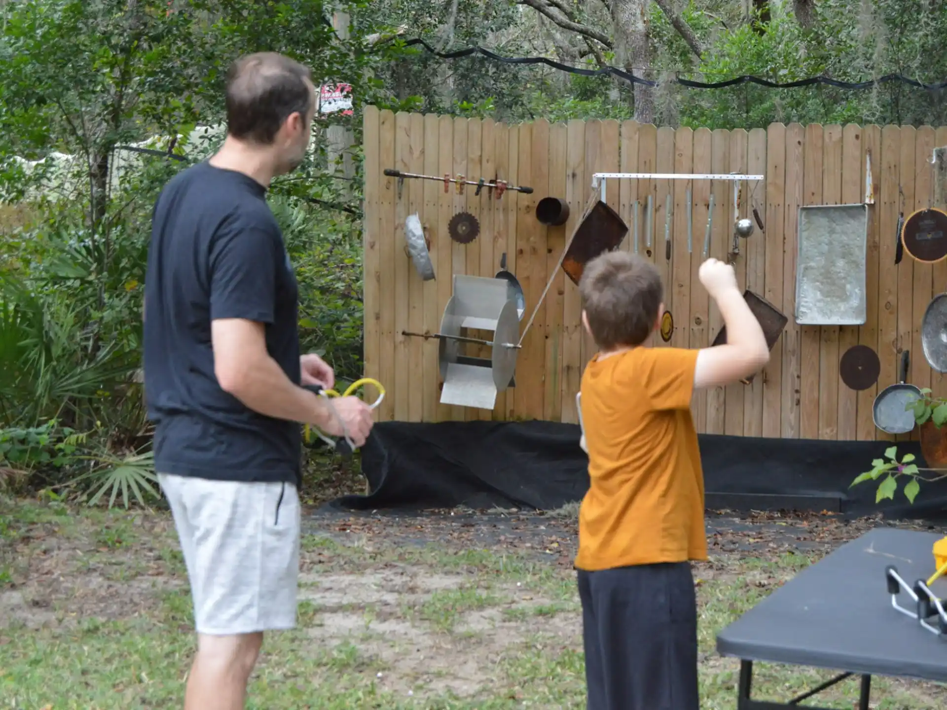 a man and a boy playing with a toy