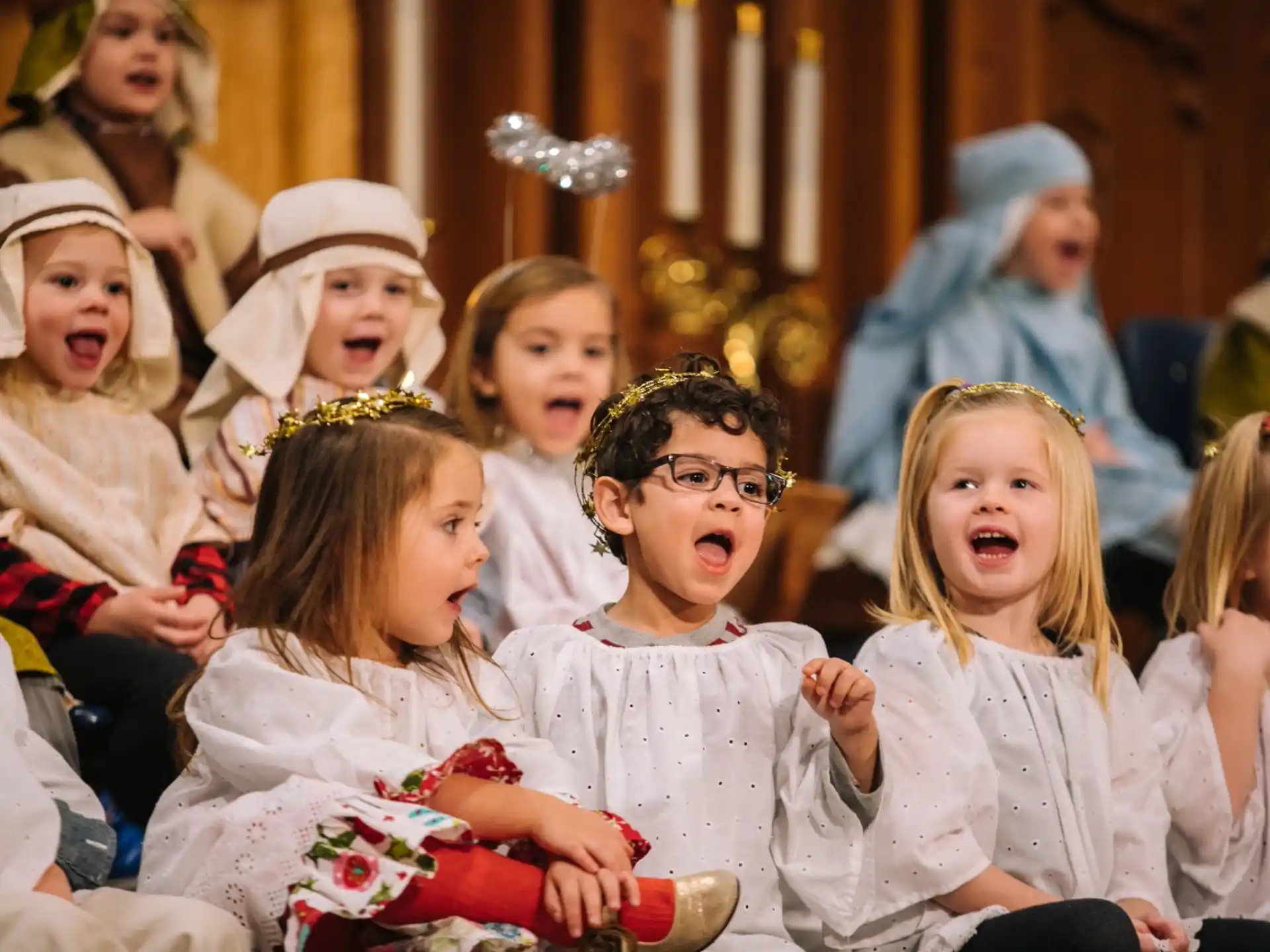 a group of children in white