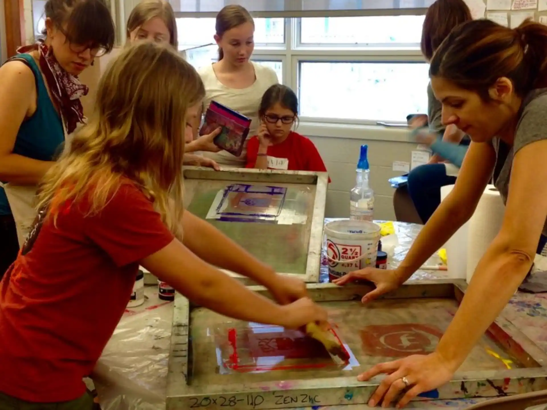 a group of children painting