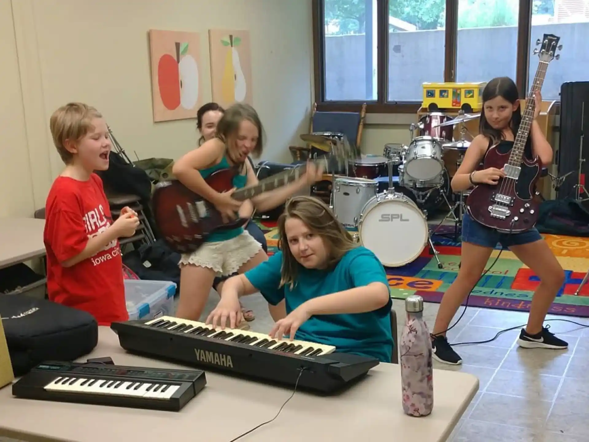 a group of kids playing instruments