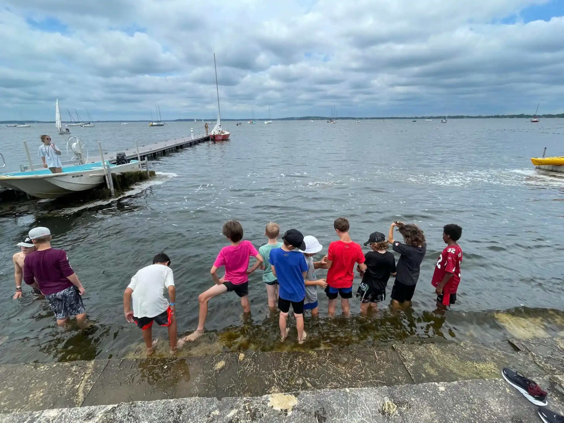 a group of people standing in the water