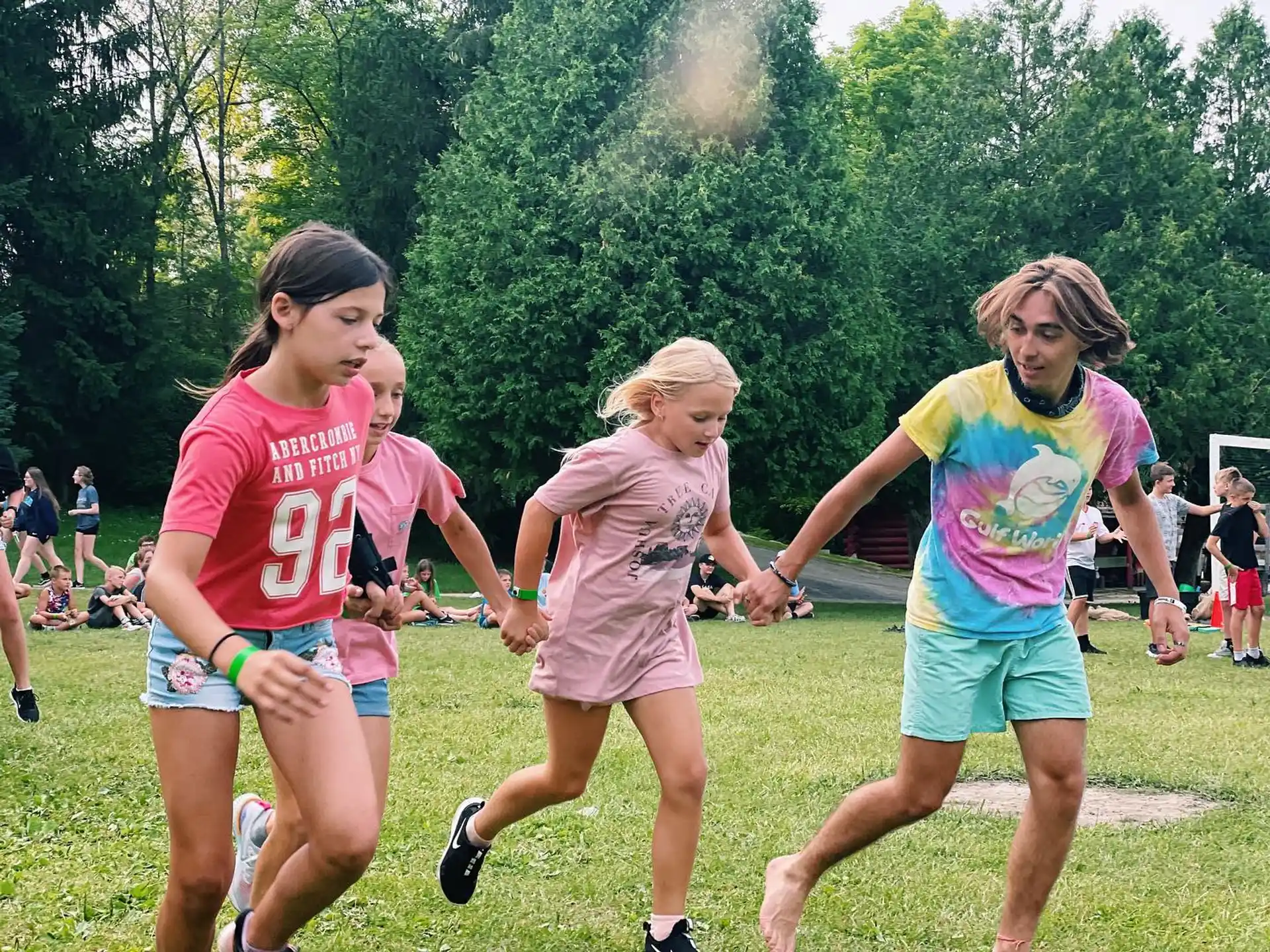 a group of girls running in a field