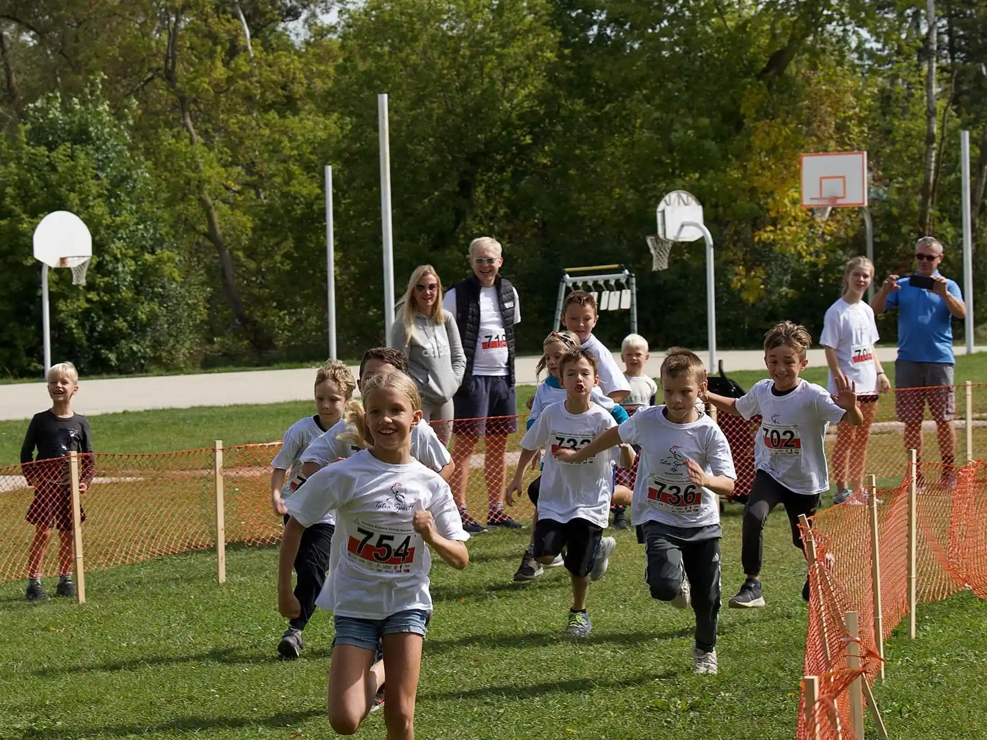 a group of people running on a field