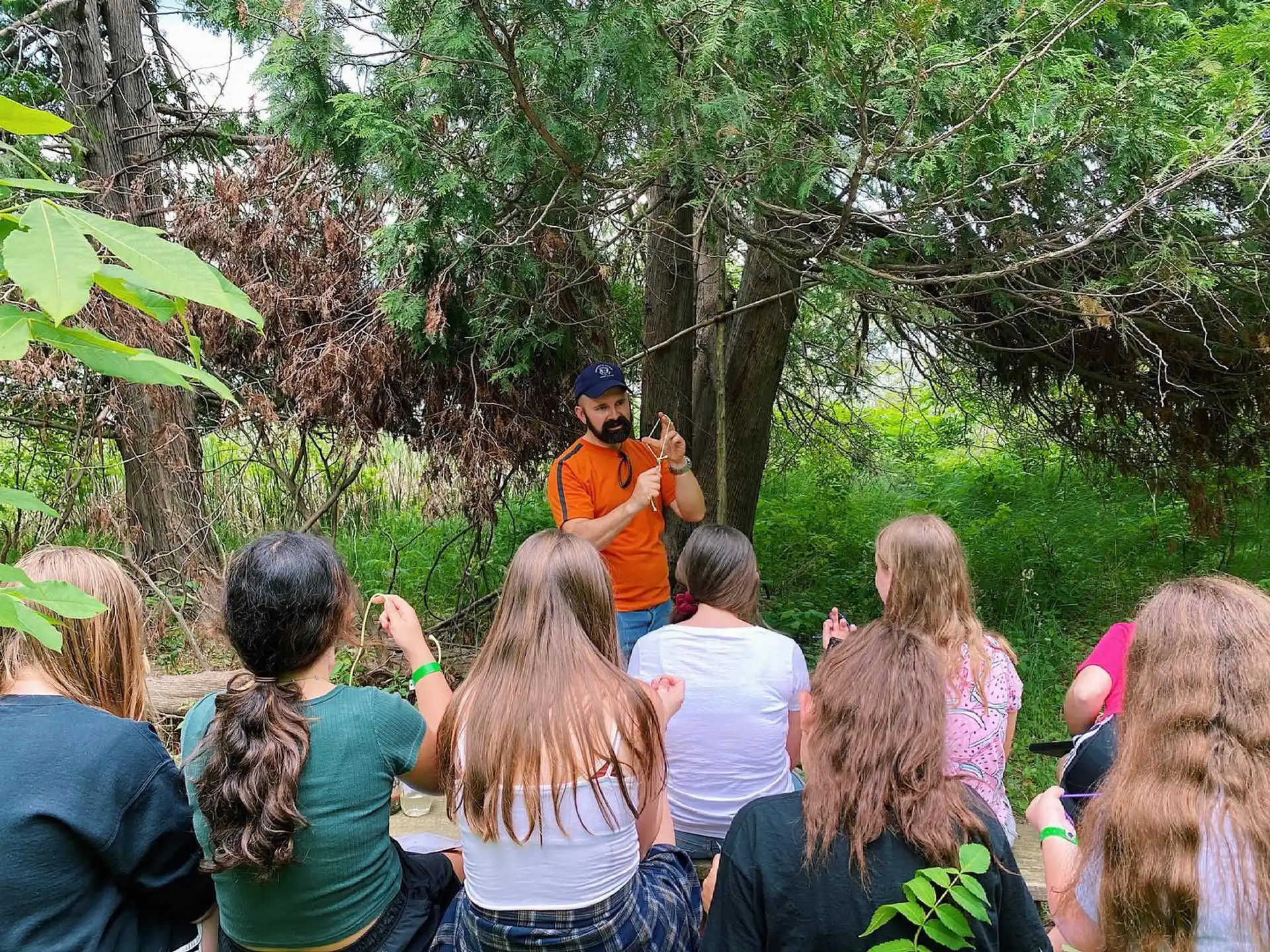 a person standing in front of a group of people
