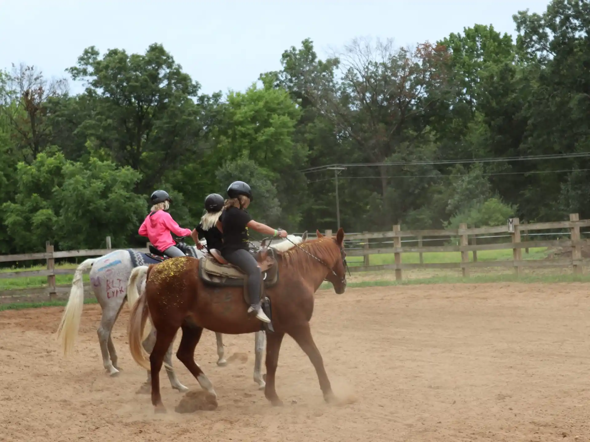 a group of people riding horses