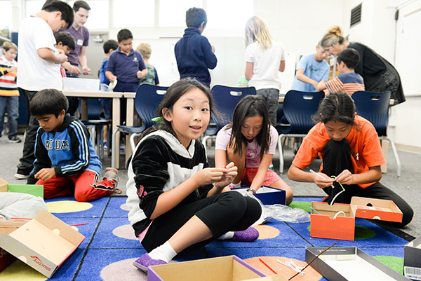 a group of children sitting on the floor