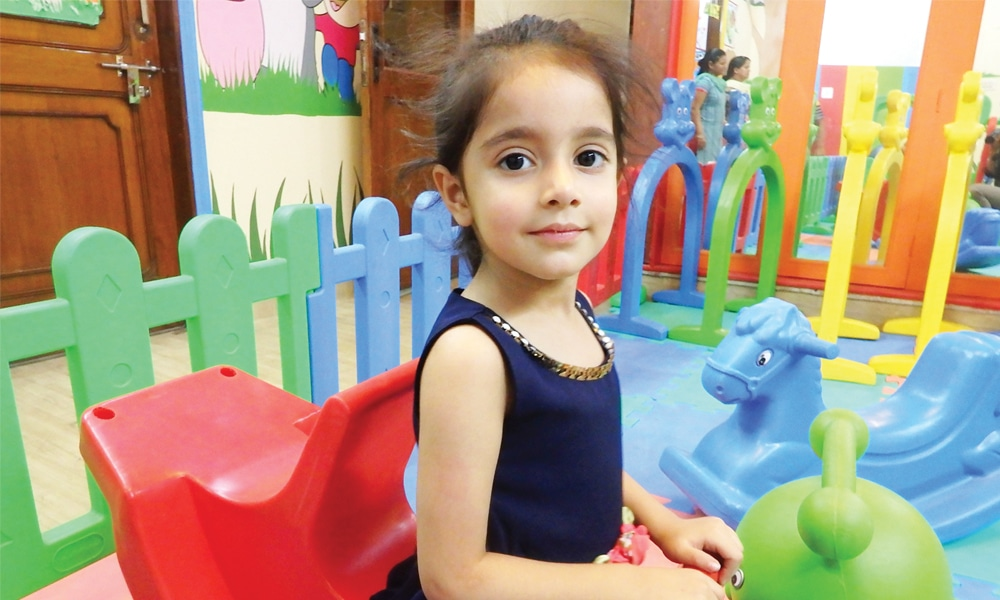 a girl sitting in a chair