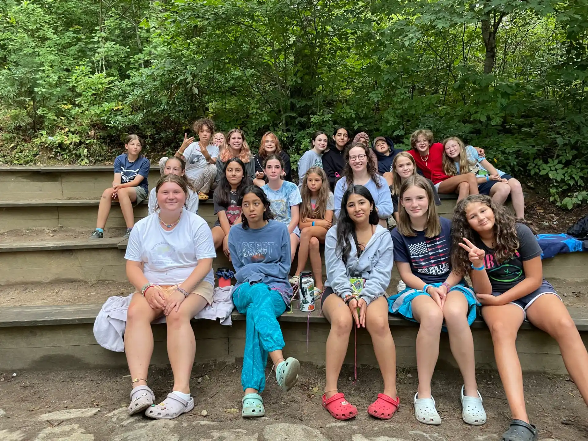 a group of people sitting on a bench