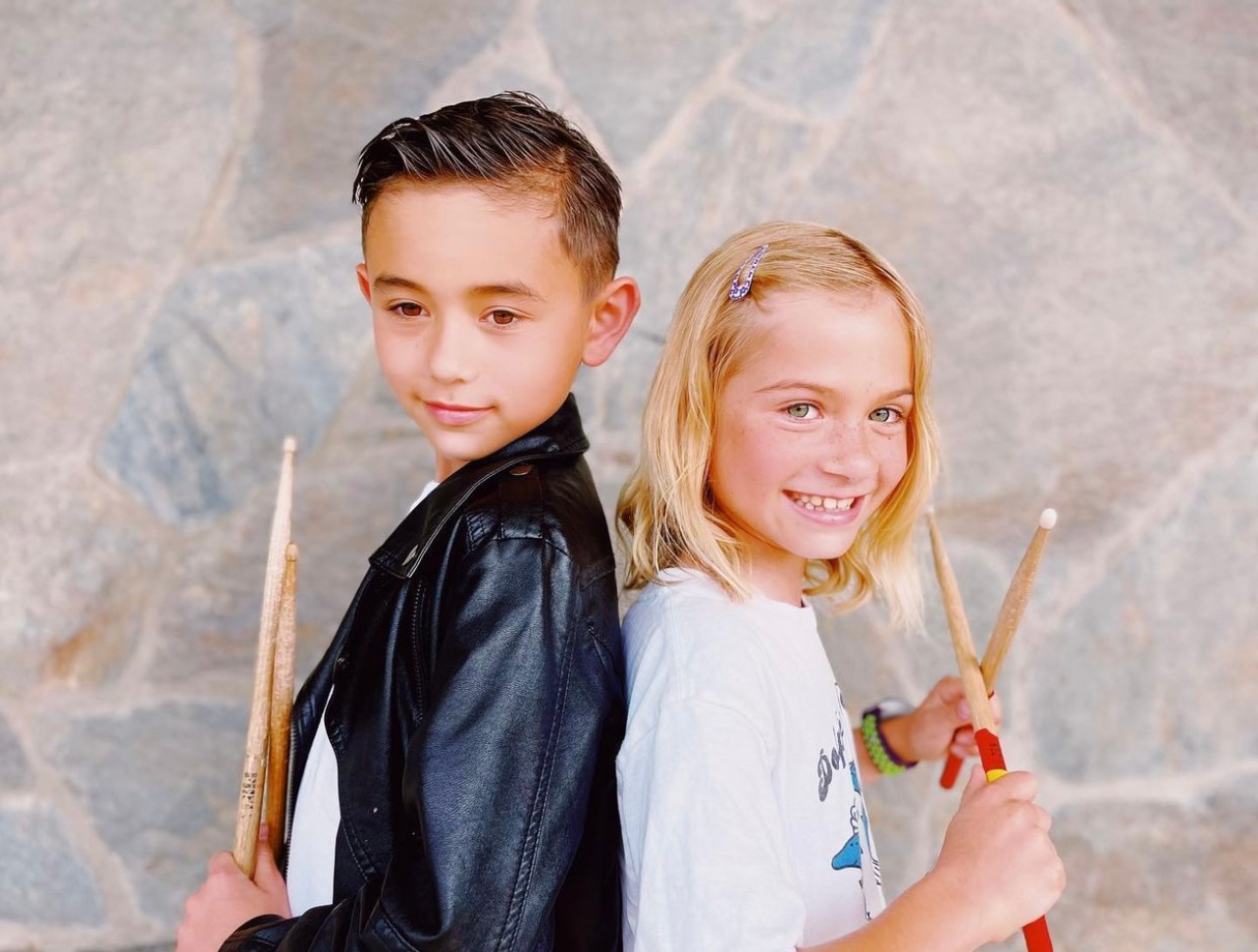 a boy and girl posing for a picture