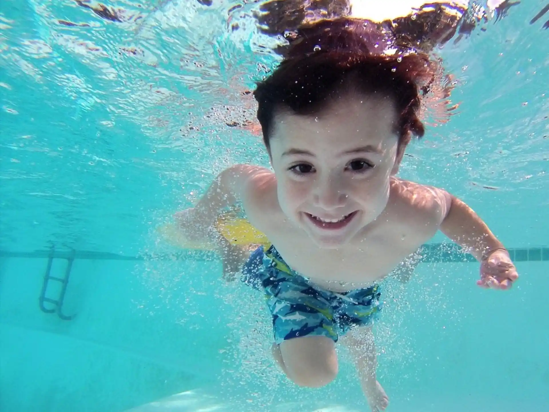 a boy in a pool
