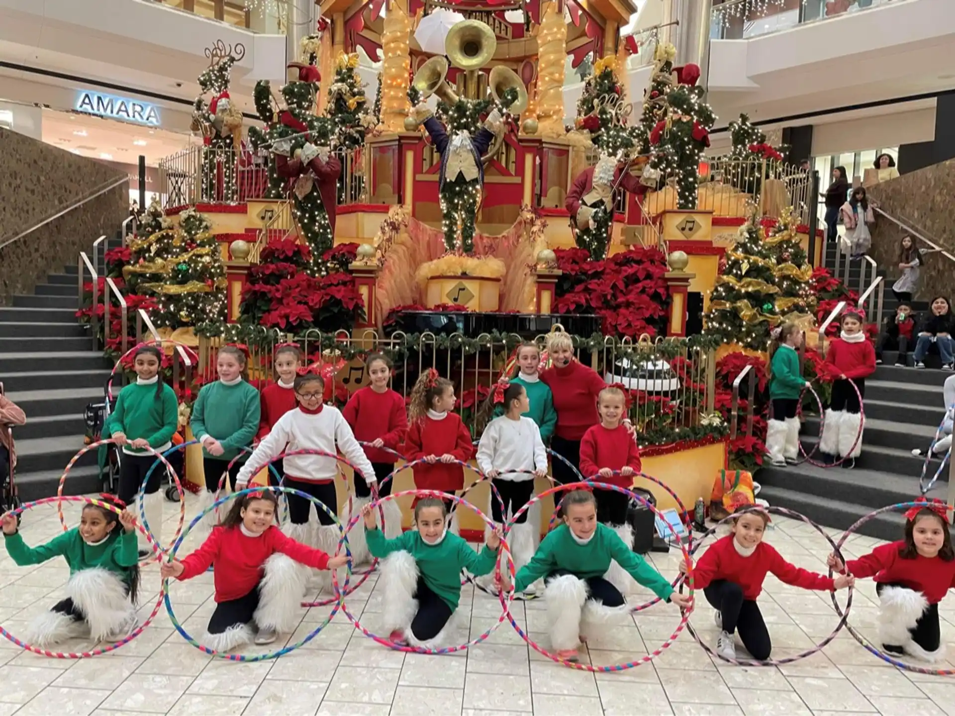 a group of people posing for a photo in front of a decorated building