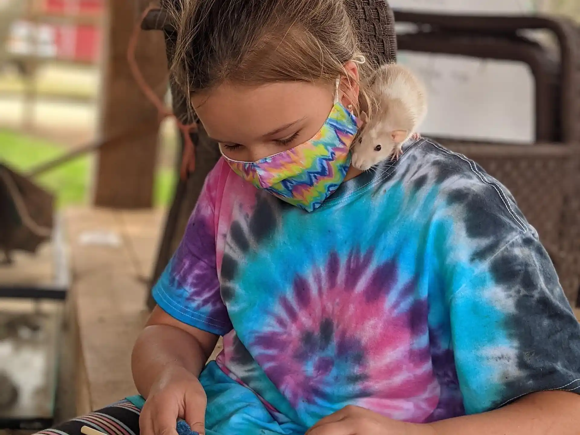 a young girl with a stethoscope around her neck