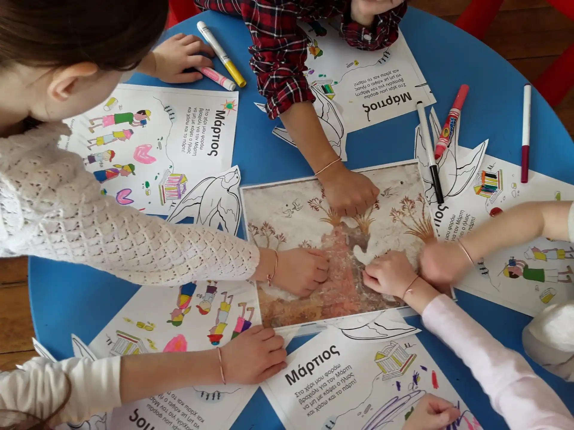 a group of children doing crafts