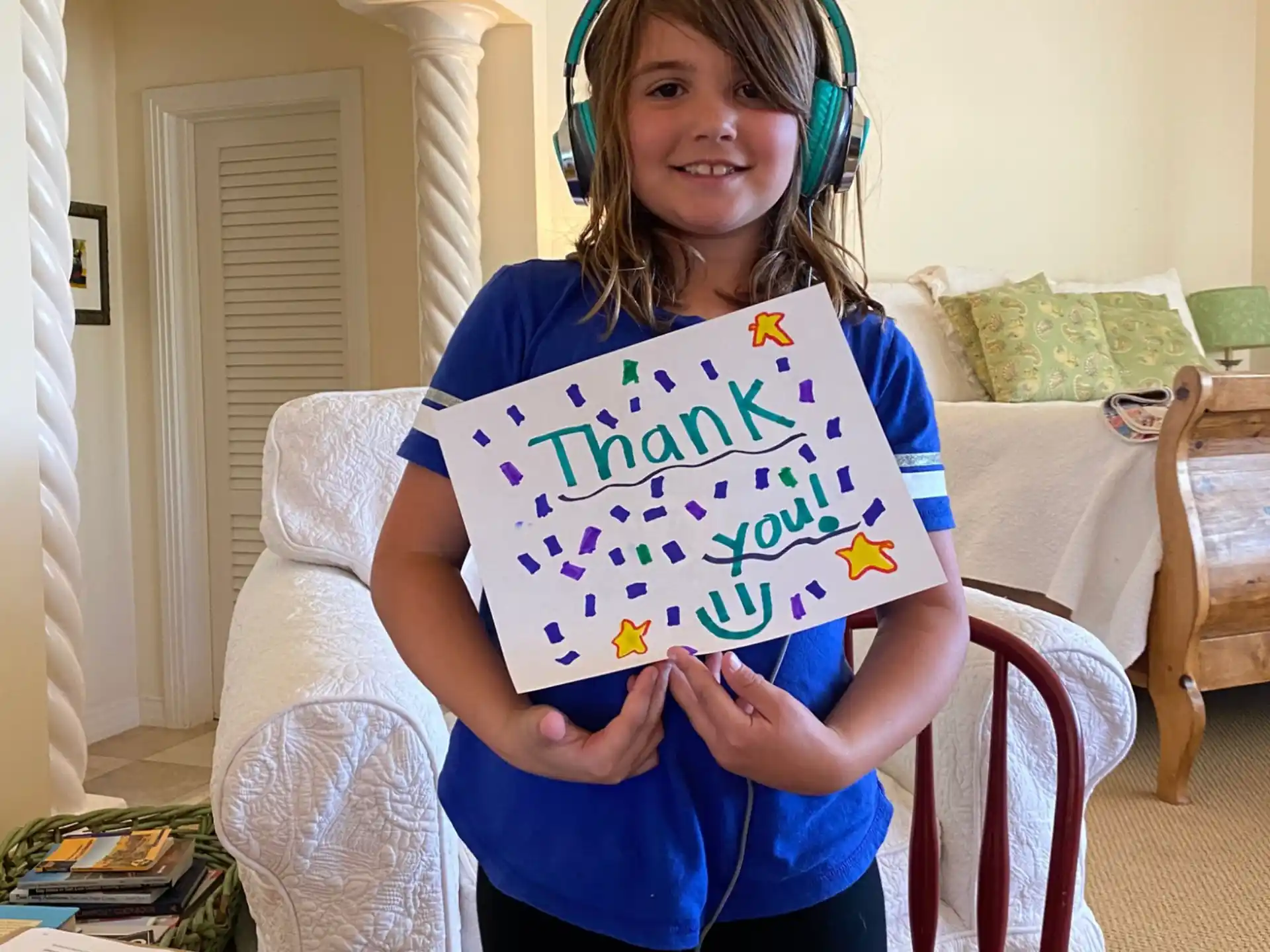 a girl holding a sign