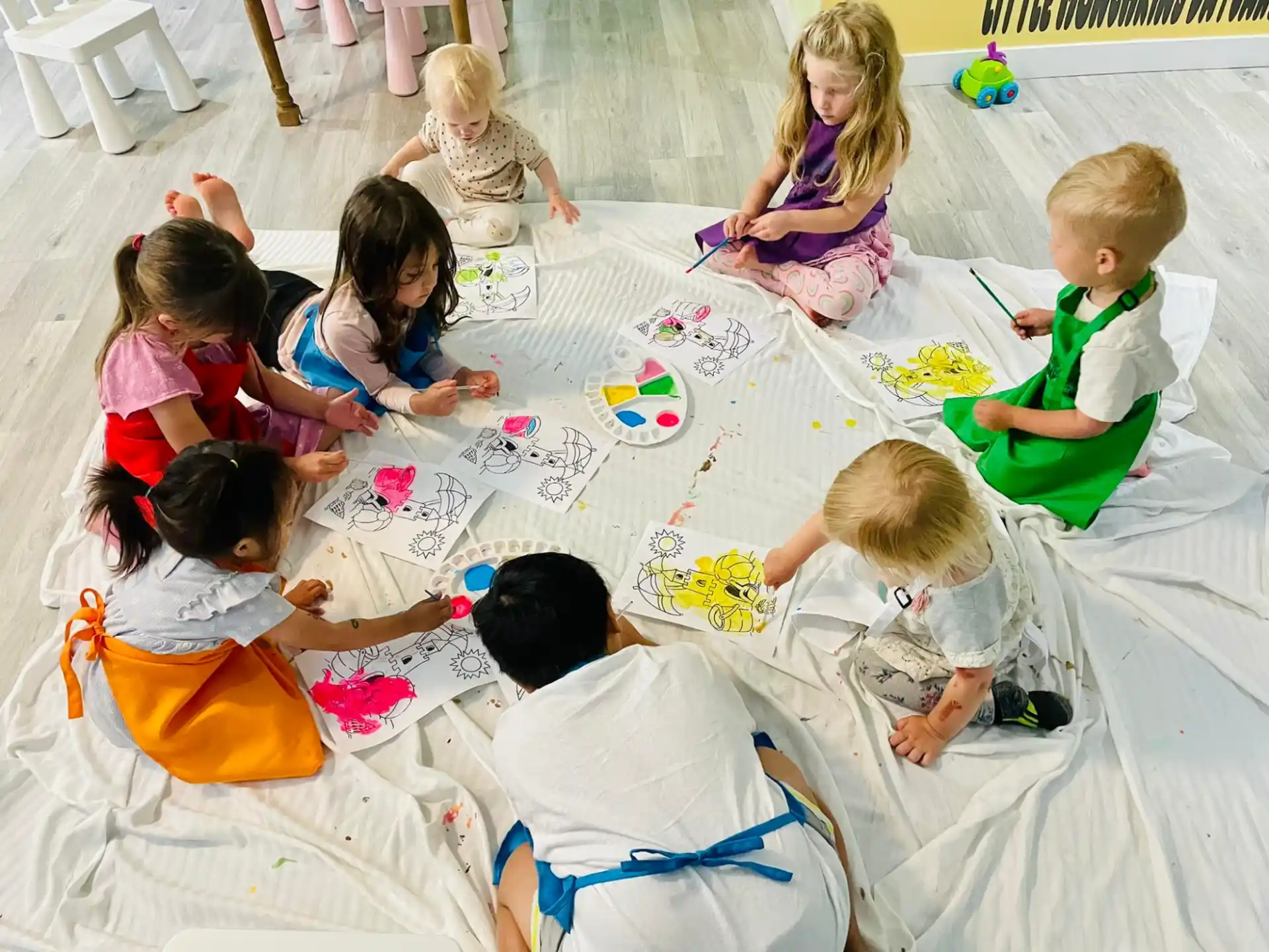a group of children sitting on the floor