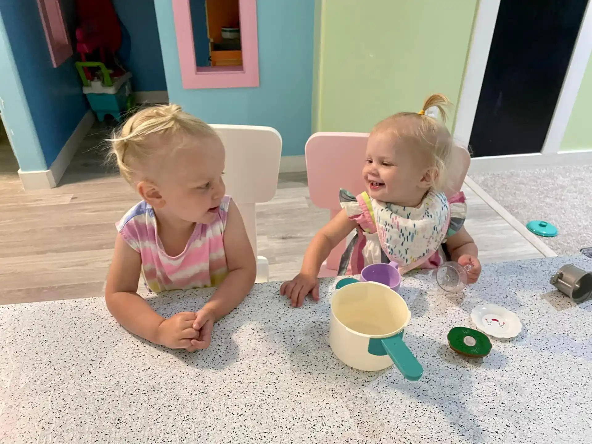 two children sitting on the floor