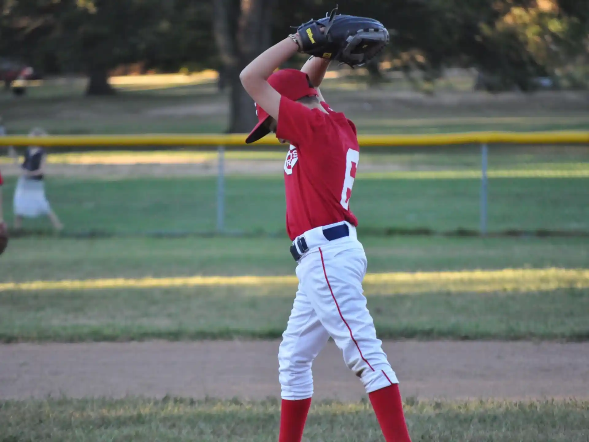 a baseball player throwing a ball