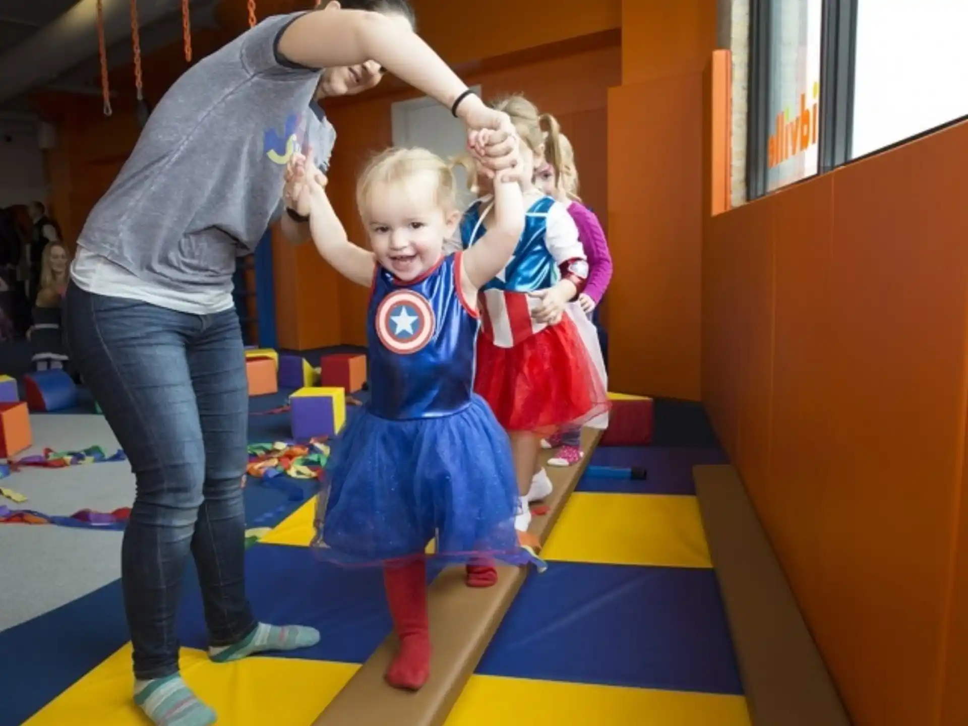 a person and a child dancing