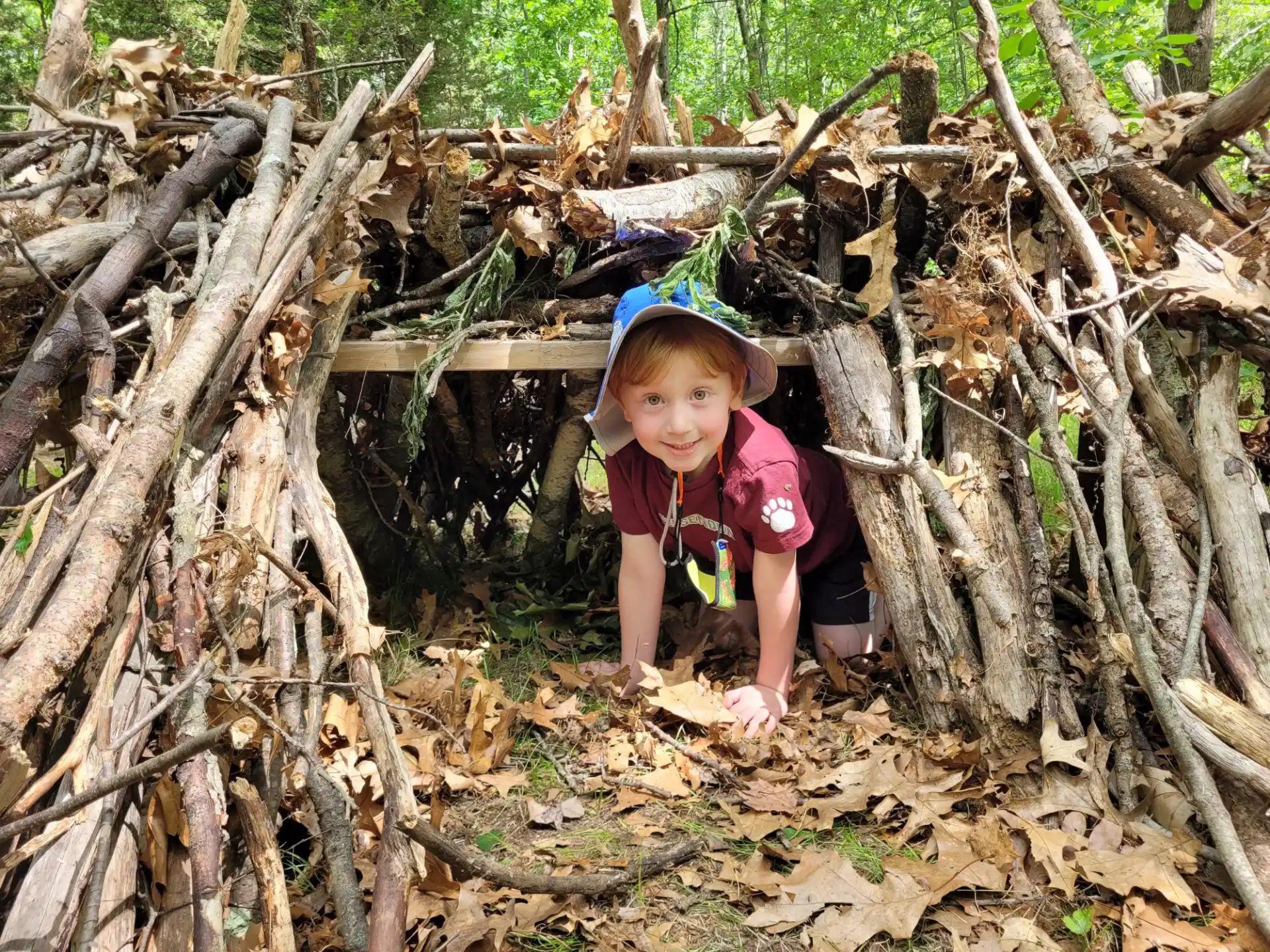 a child in a pile of sticks