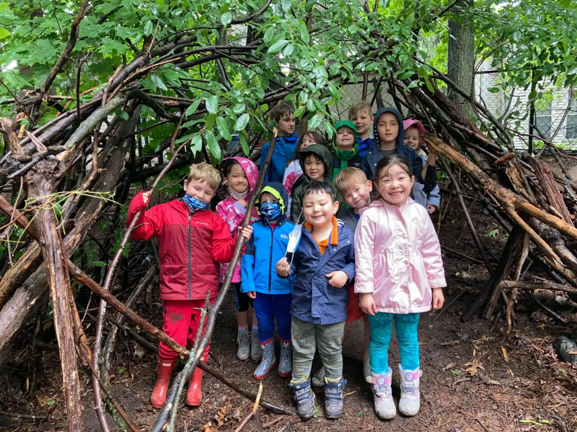 a group of children standing in a tree