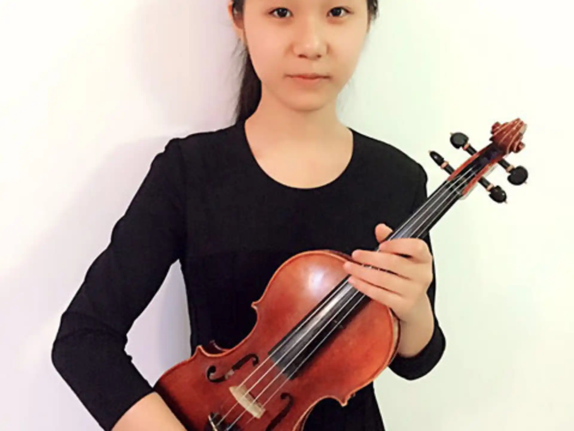 a person holding a violin