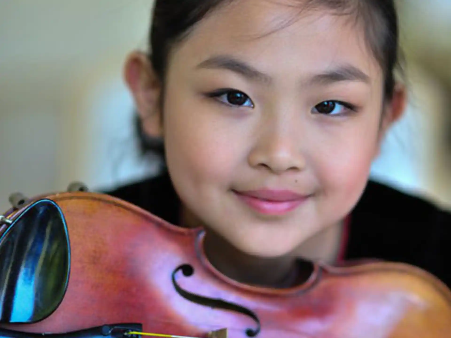 a person holding a violin