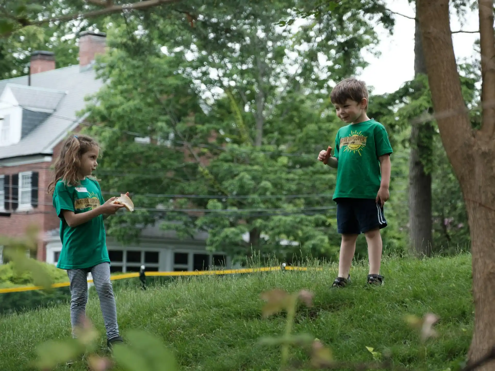 a couple of kids playing in a yard