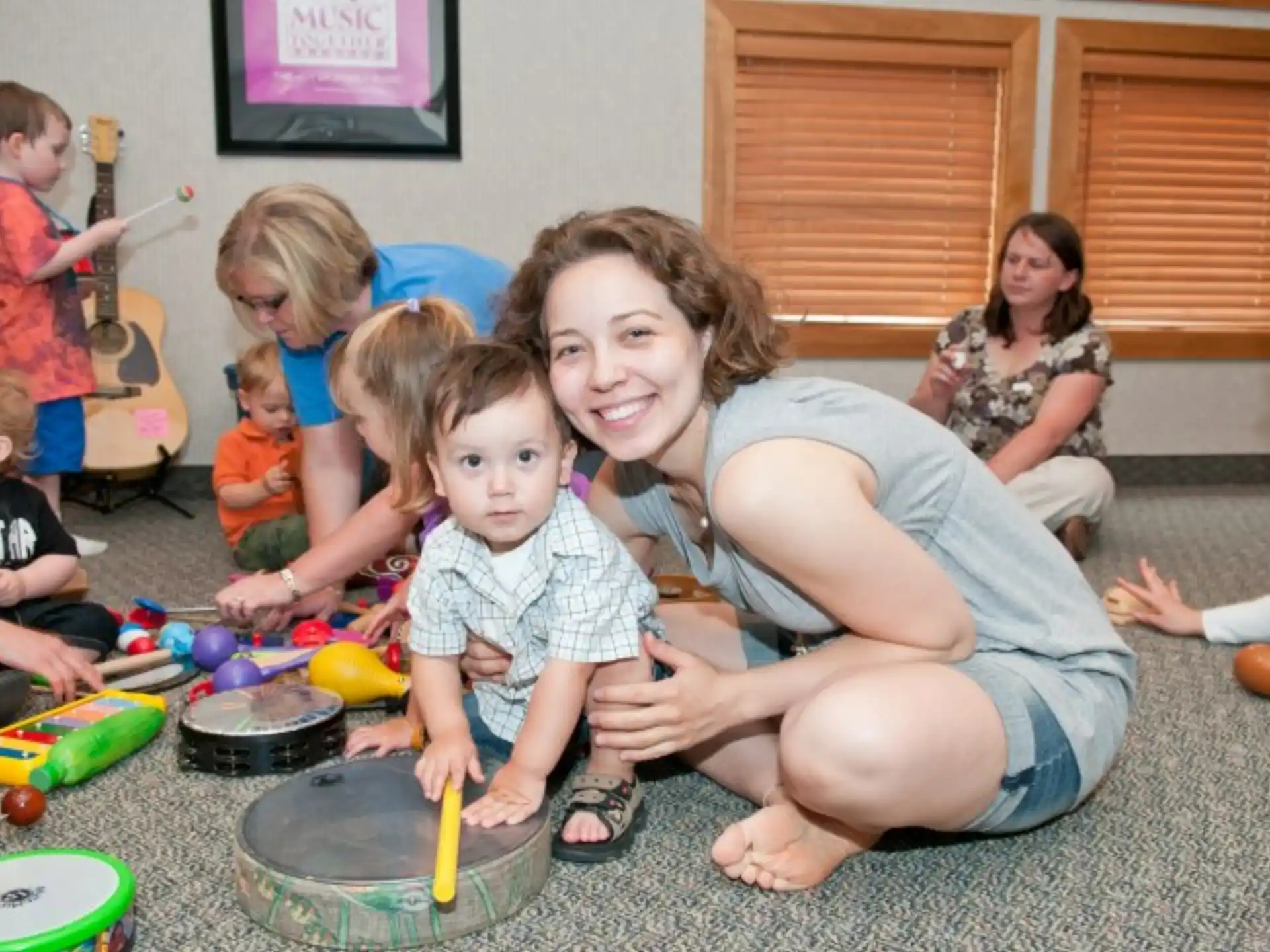 a person and a group of children playing with toys
