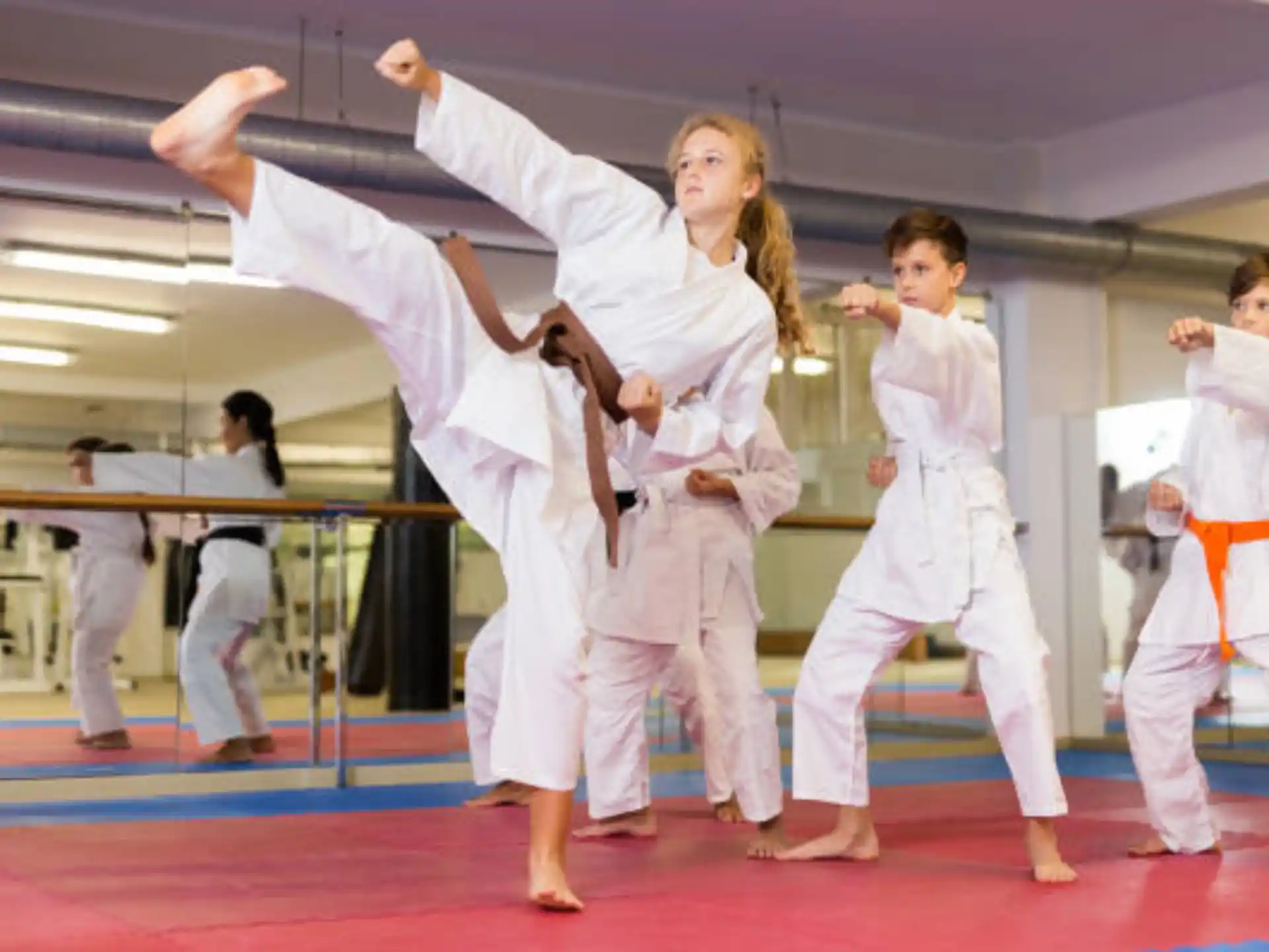 a group of people in karate uniforms