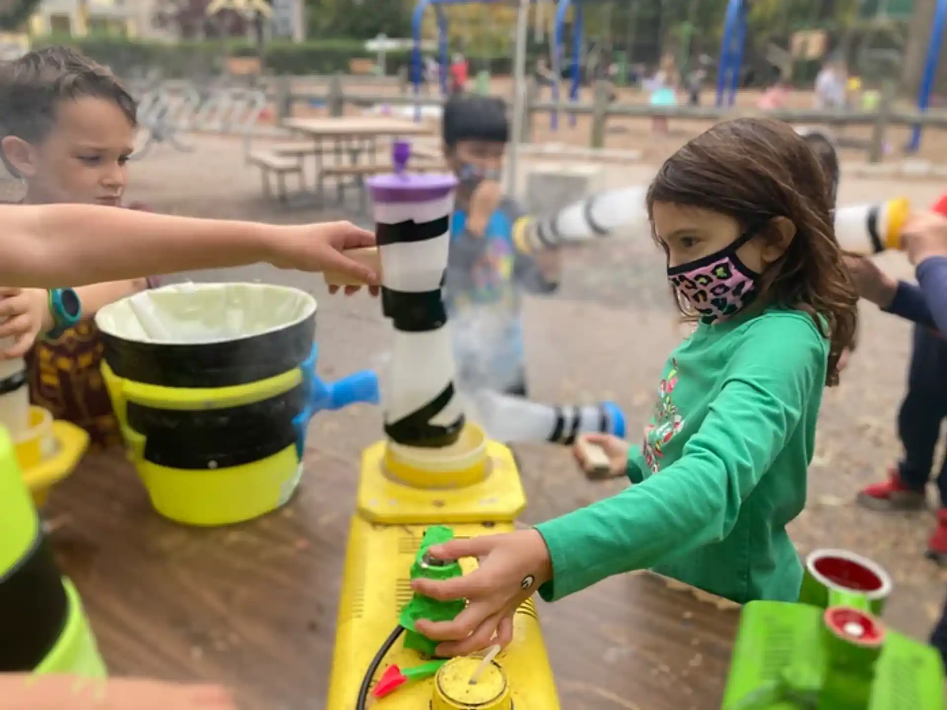 children playing with buckets