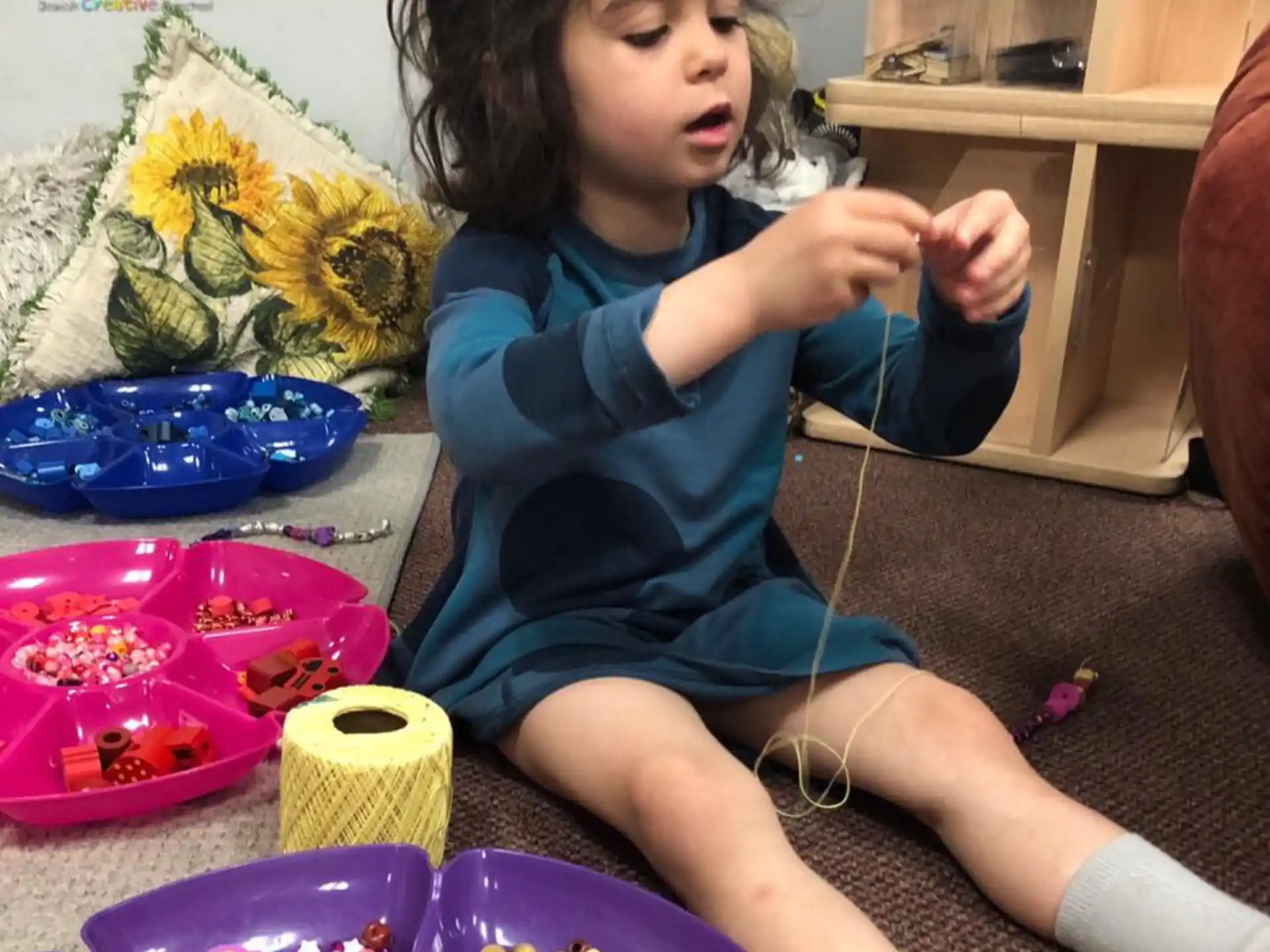 a child sitting on the floor