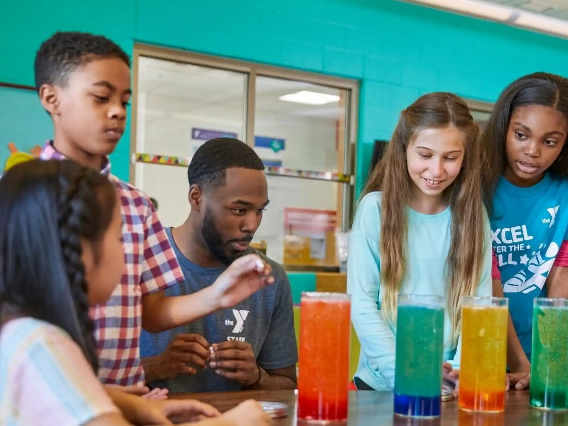 a group of people sitting at a table with drinks