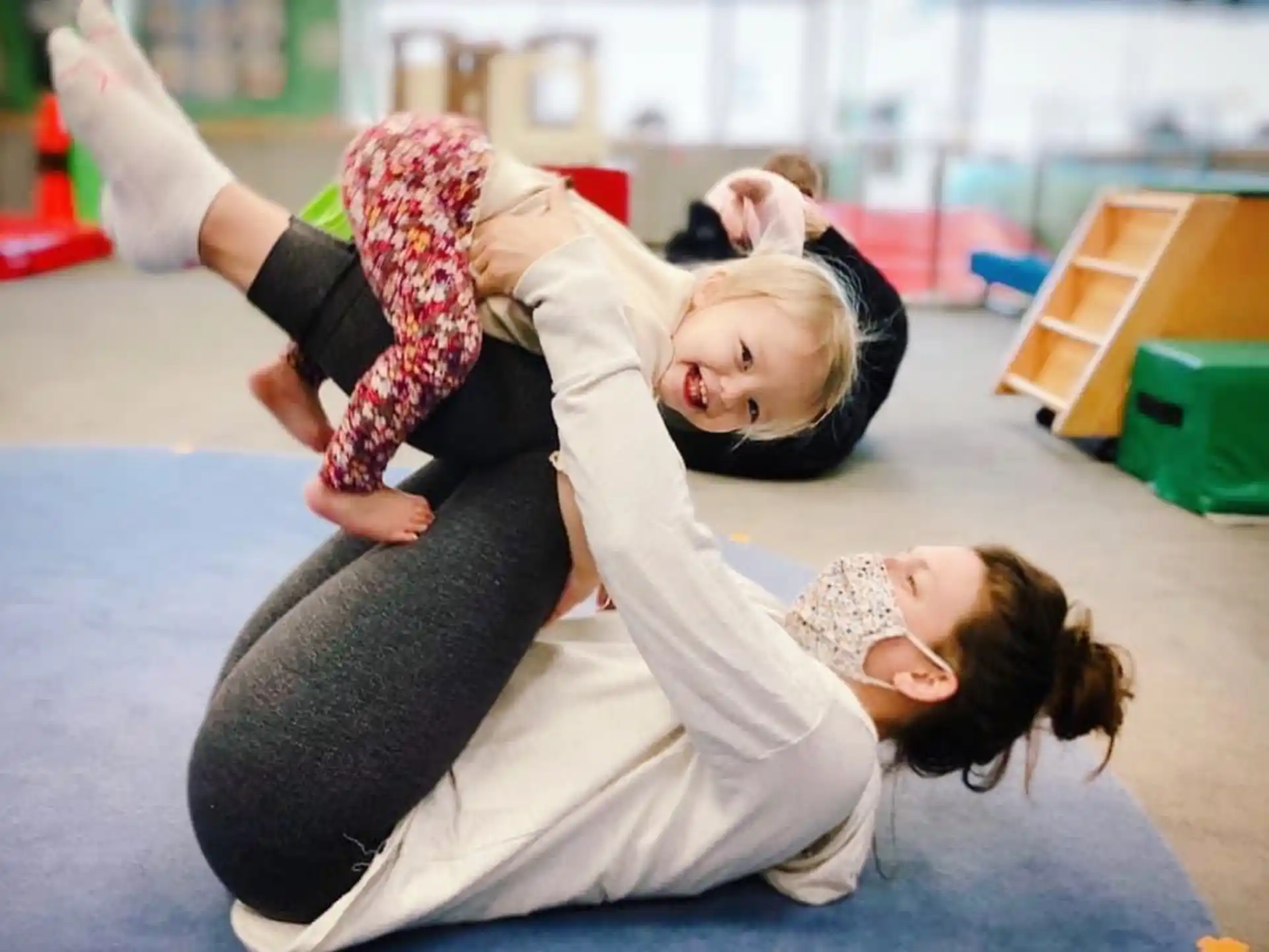 a person holding a girl