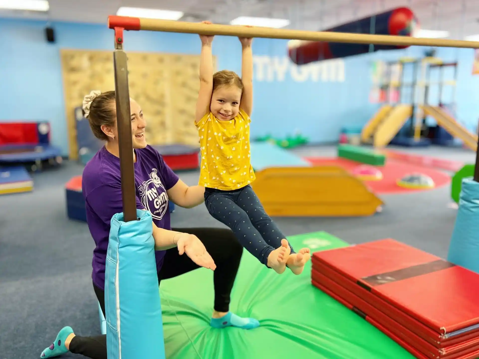 a woman and a child on a bar