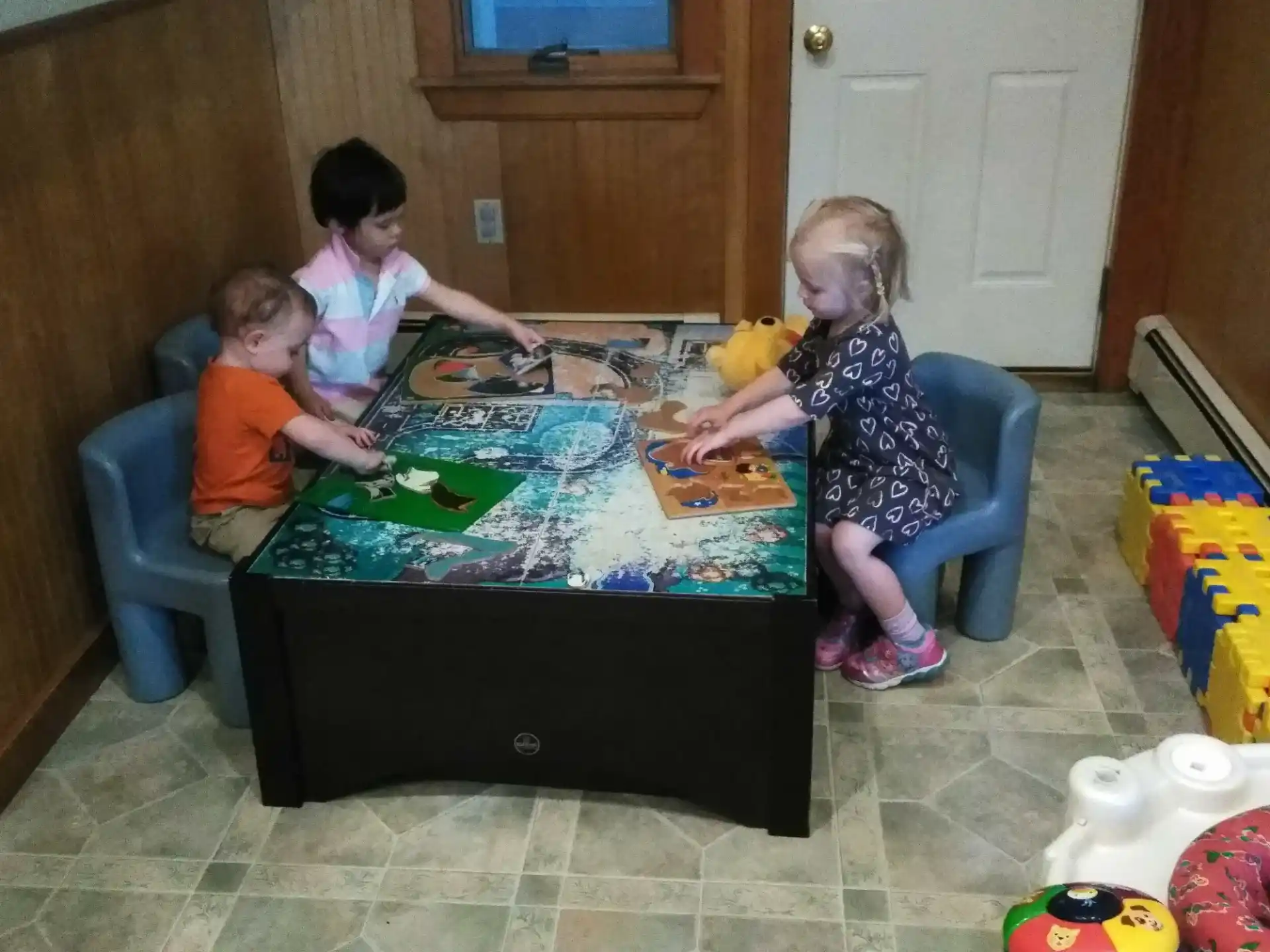 a group of children playing a board game