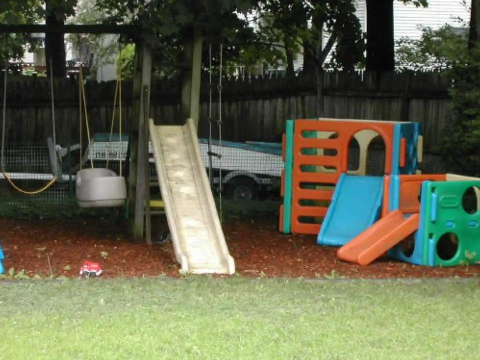 a playground with a slide and a slide