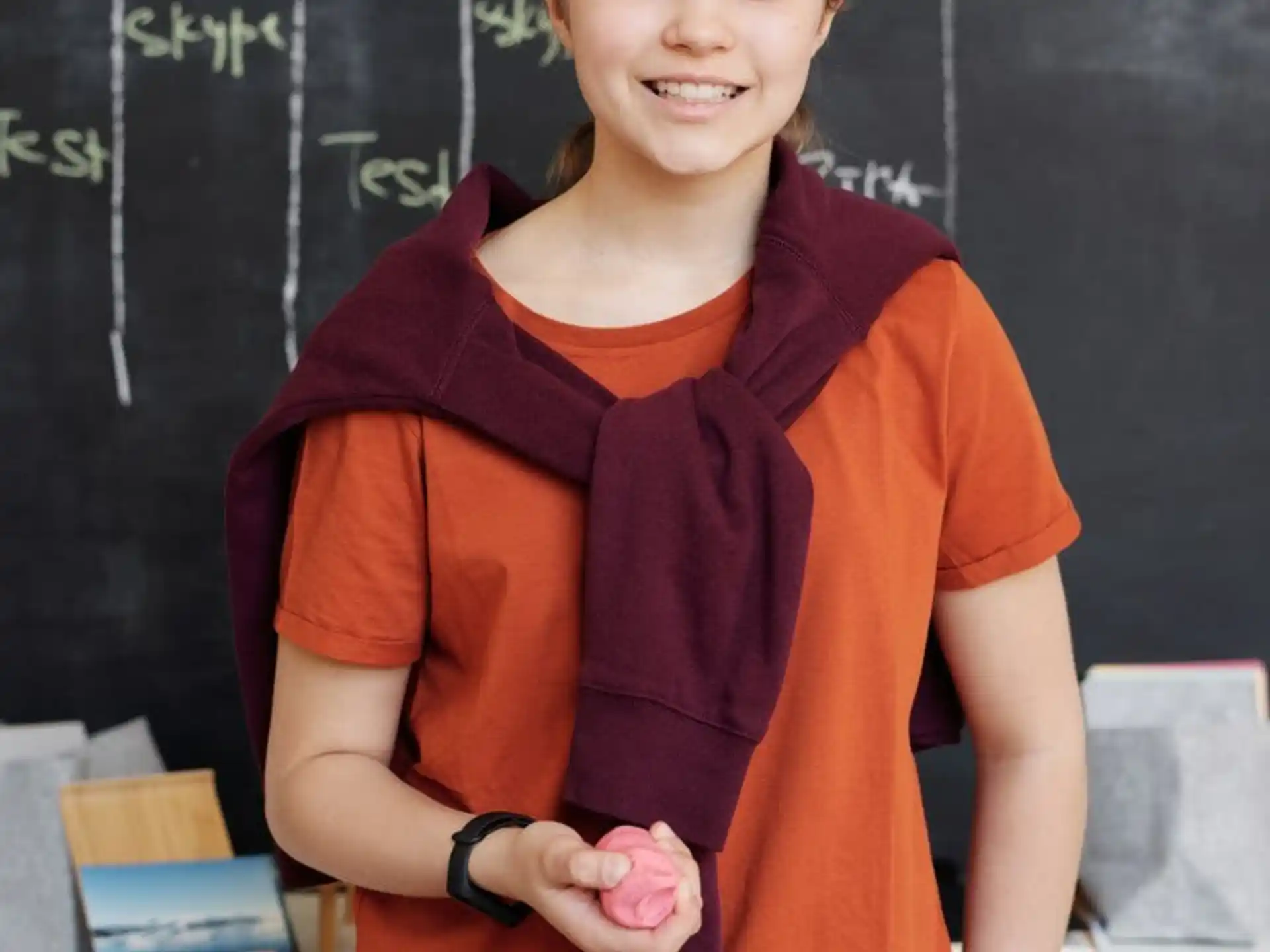 a person standing in front of a chalkboard