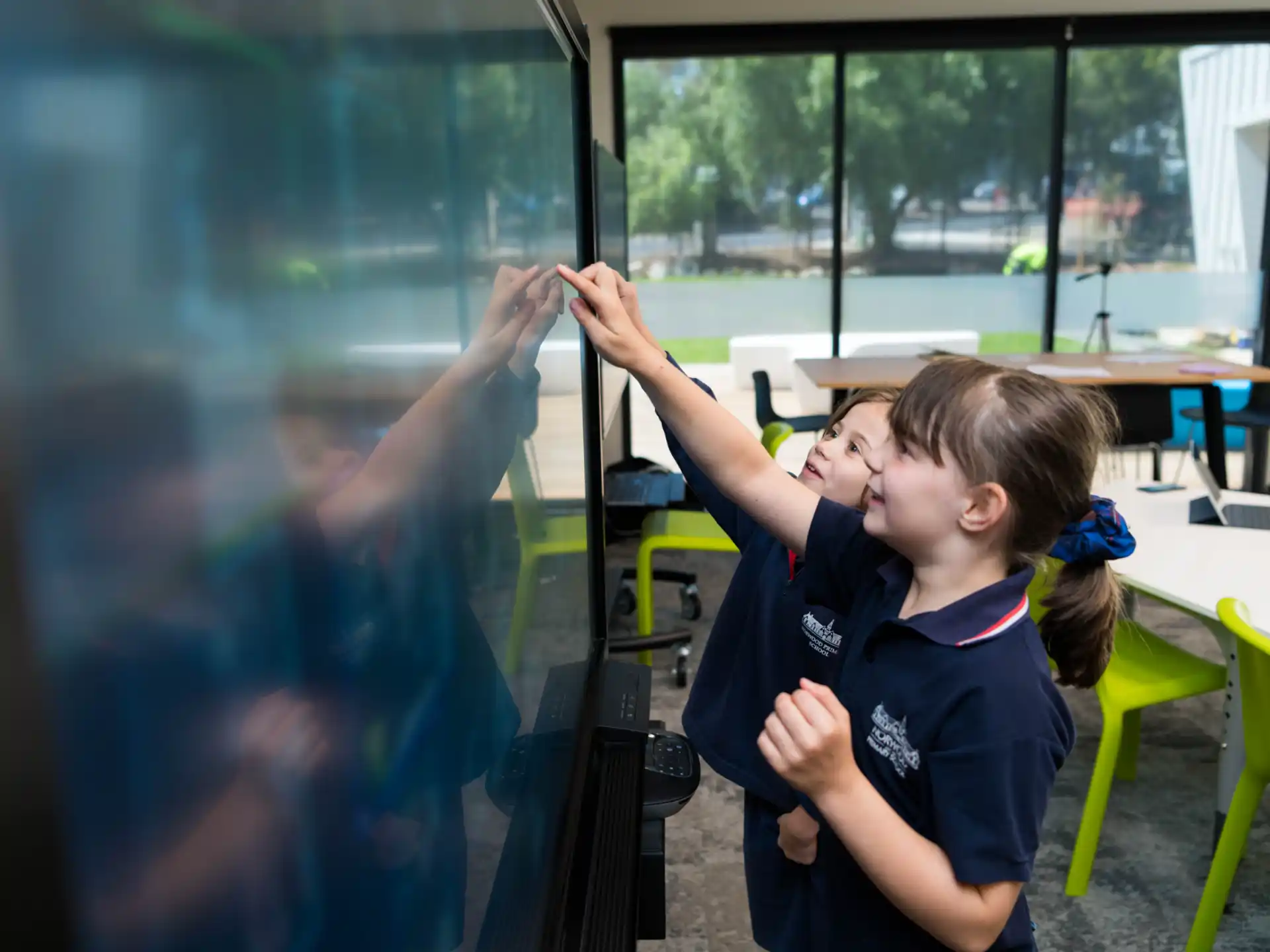 a girl painting a window
