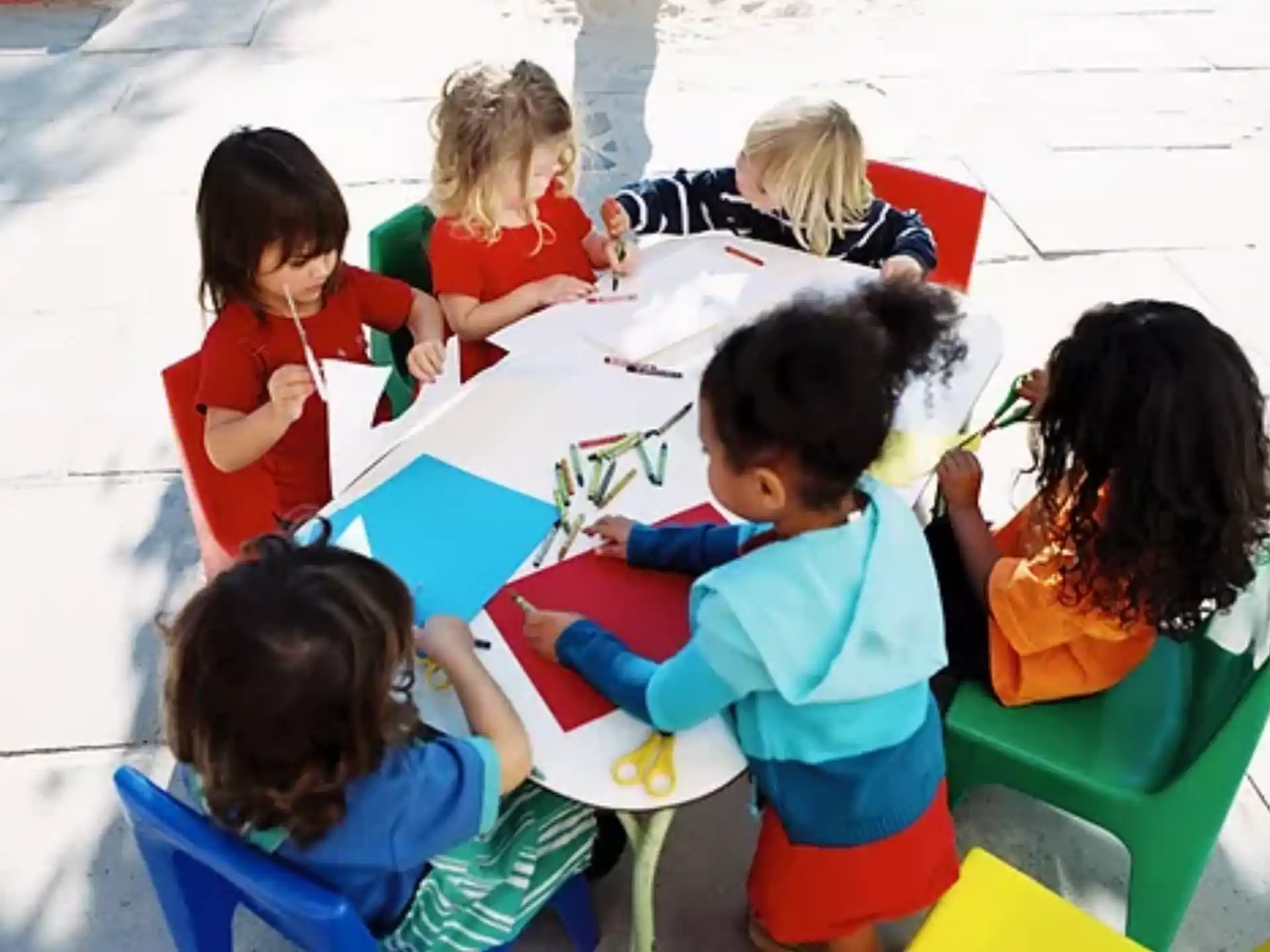 a group of children painting