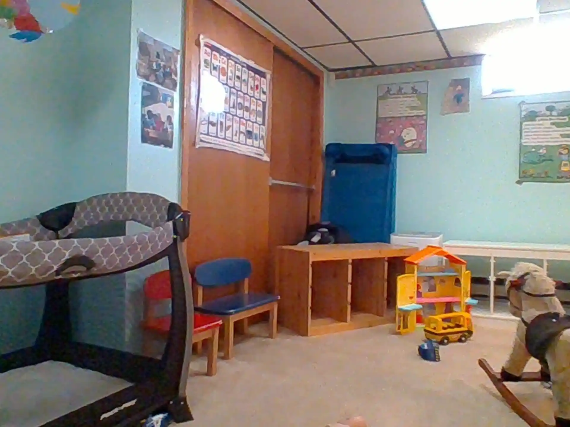 a room with bunk beds and a desk