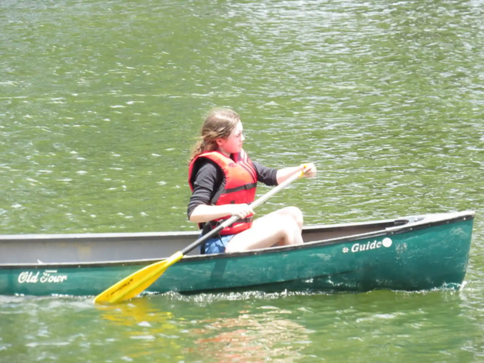 a girl in a canoe