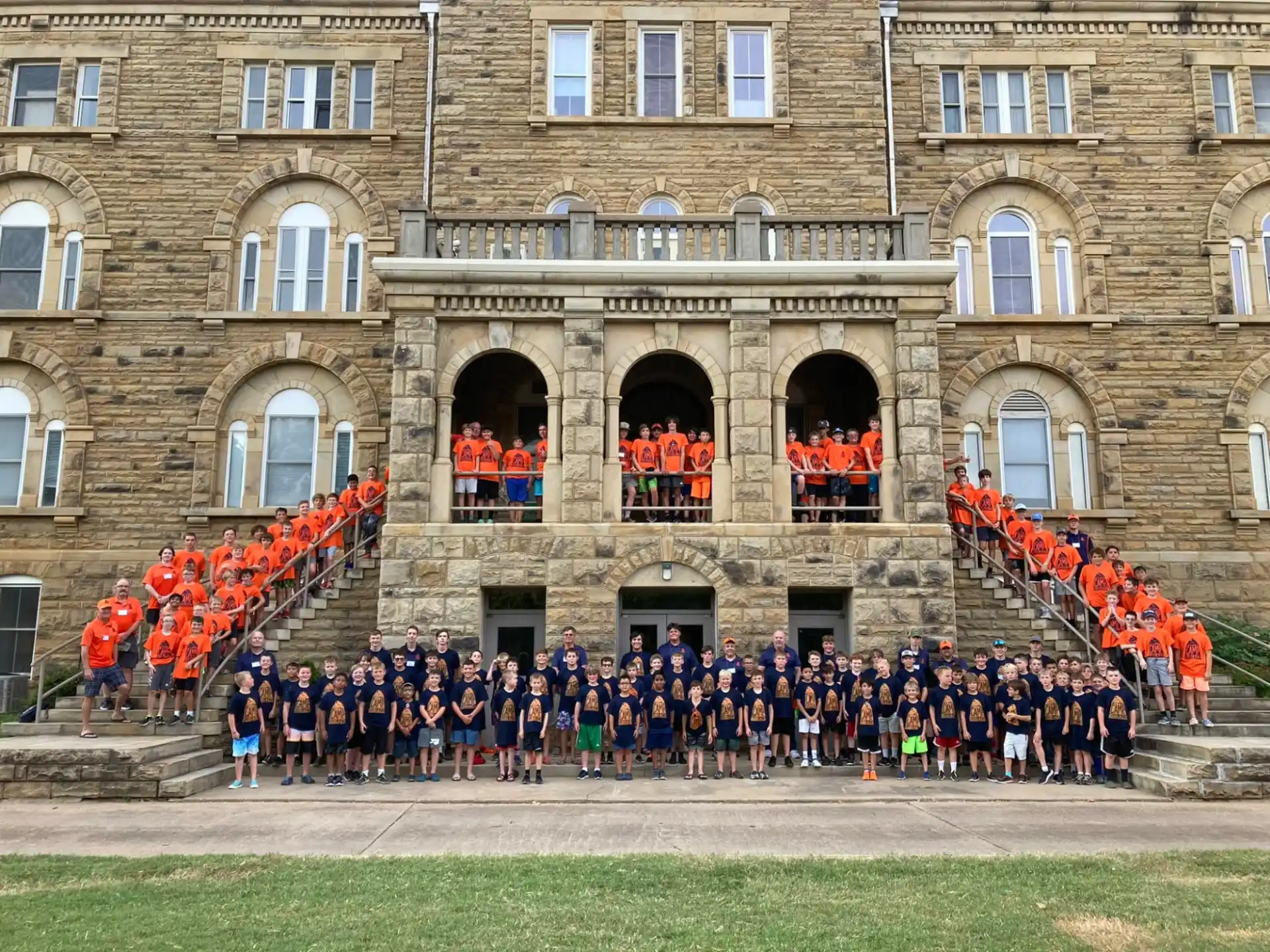 a group of people standing in front of a building