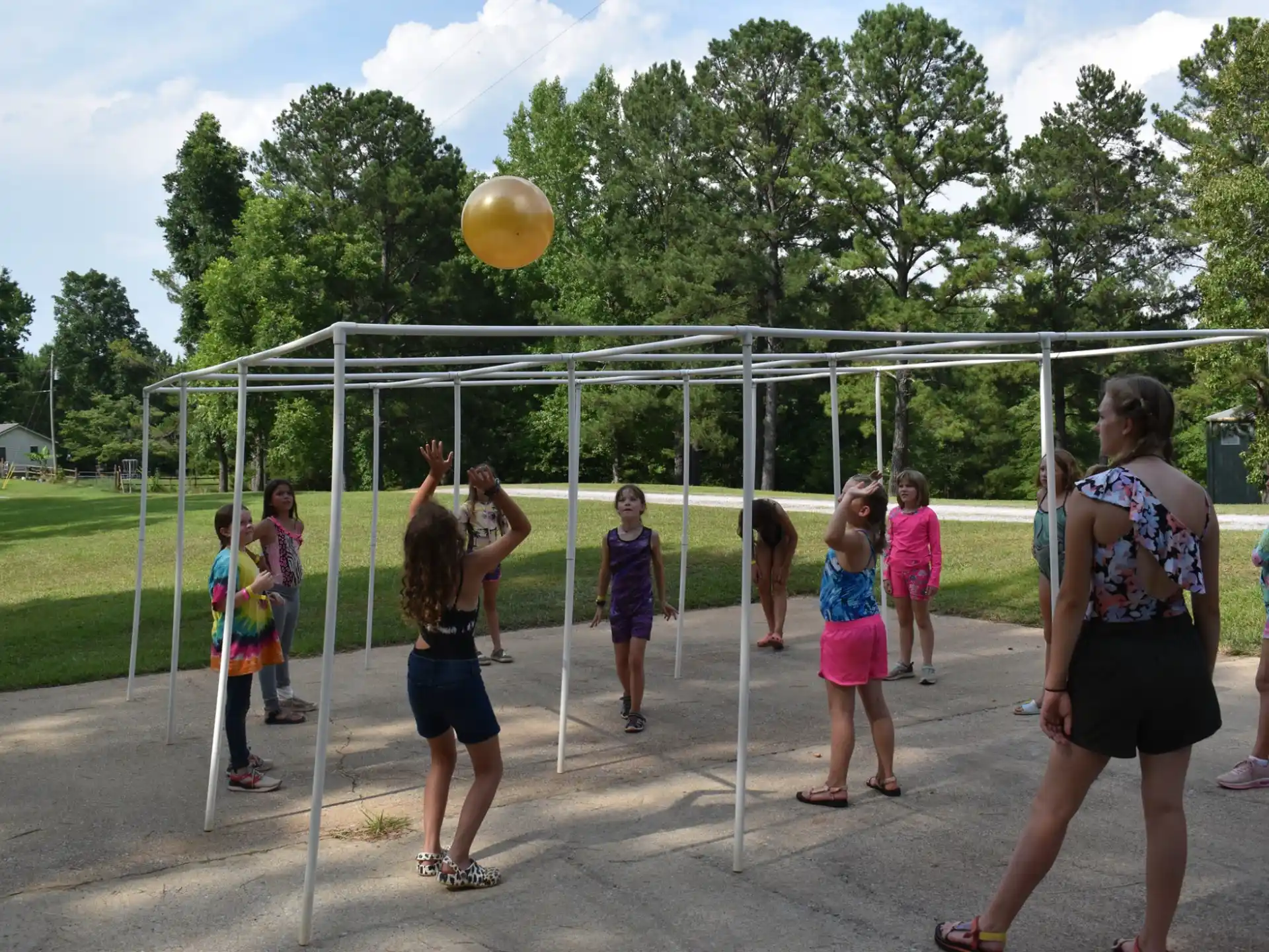 a group of people playing volleyball