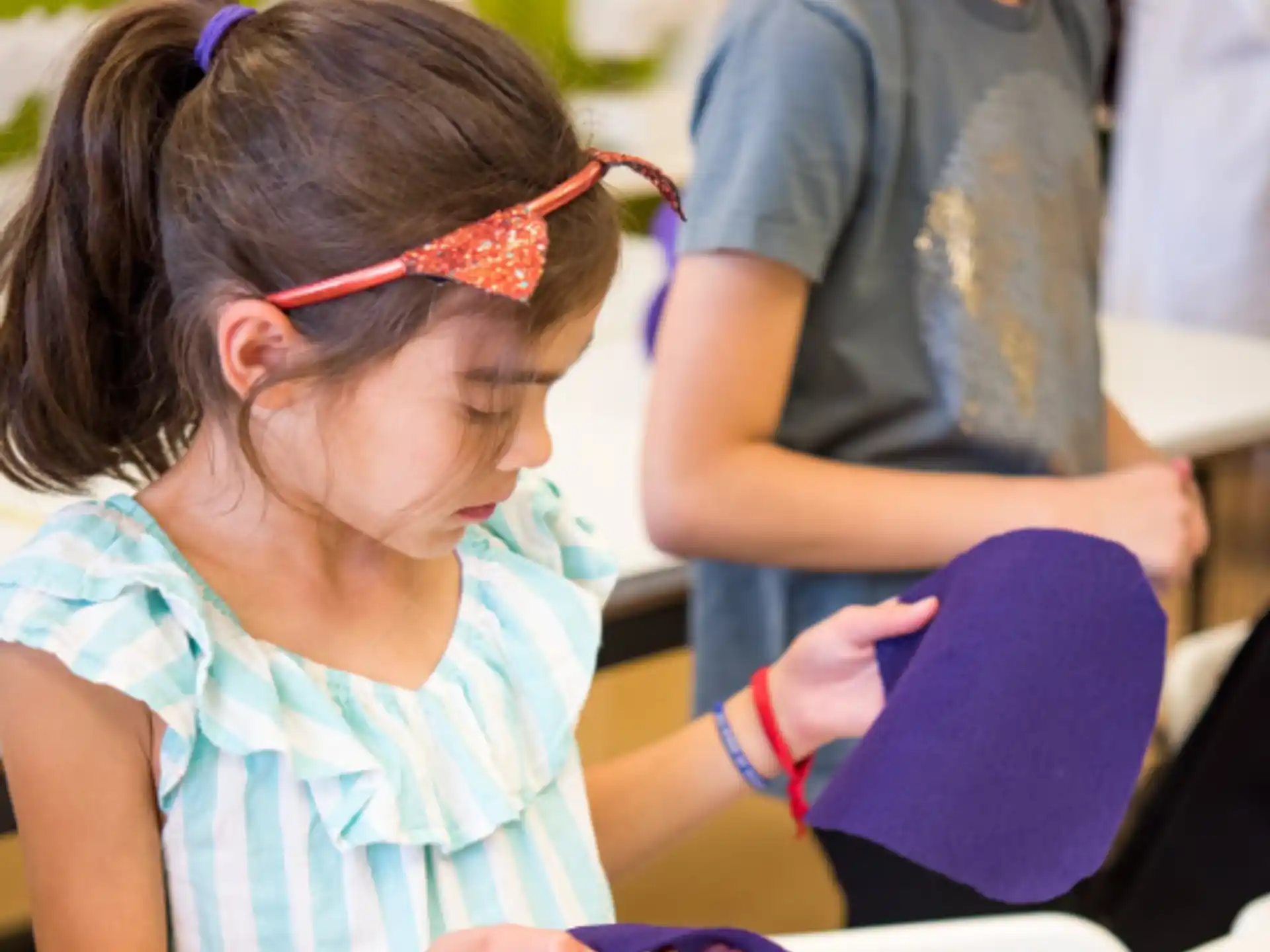 a young girl reading a book